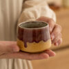 artisan-espresso-cup-lifestyle Artisan ceramic espresso cup in lifestyle setting showcasing handmade craftsmanship