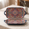 etailed side profile view of the integrated dual handles on a bohemian mandala rectangular ceramic baking dish.