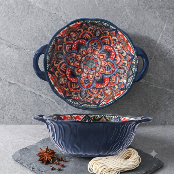 A hot cheese gratin freshly served in a bohemian mandala round ceramic baking dish on a bistro table.