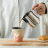 bulk-gradient-ceramic-coffee-mugs Bulk gradient ceramic coffee mugs with creative crumpled shapes stacked for modern restaurant tableware.