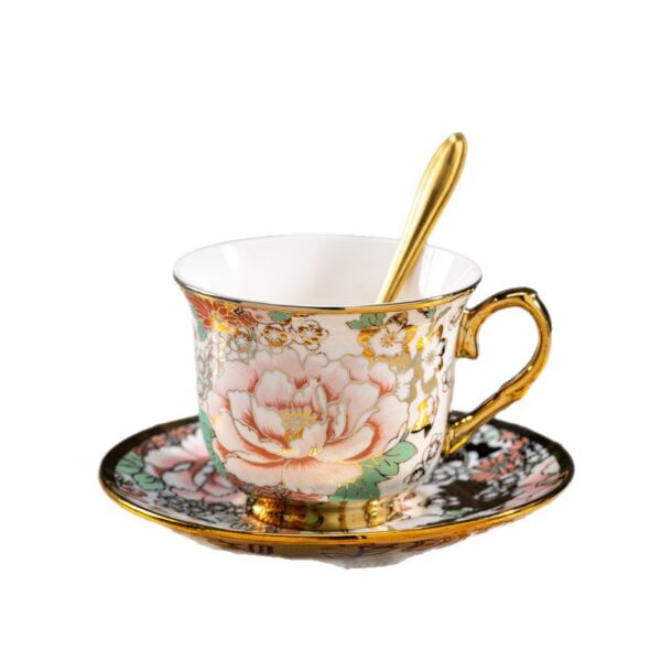 Close-up of the delicate gold-rim and intricate peony pattern on the custom ceramic tea cup.