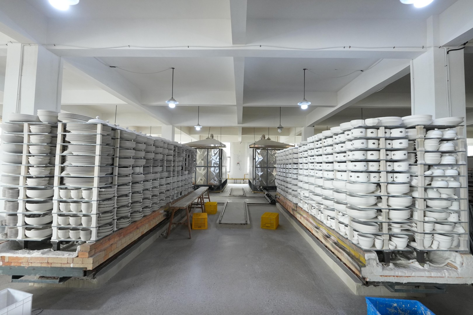 Inside look of our modern ceramic manufacturing factory and high-capacity tunnel kilns producing wholesale commercial dinnerware.