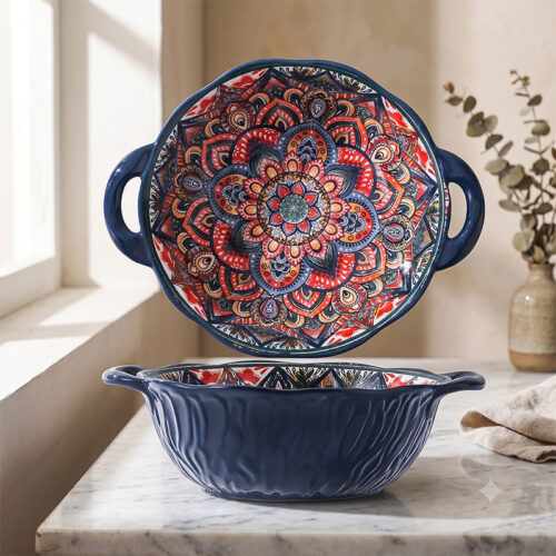 Close-up view of the dark blue fluted wave relief textured exterior and sturdy handle of a bohemian mandala round ceramic dish.