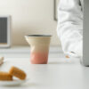 mini-crumpled-ceramic-espresso-cup Mini crumpled ceramic cup in obsidian black and teal gradient glaze, perfect for single espresso shots.