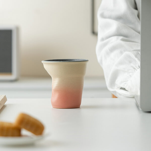 mini-crumpled-ceramic-espresso-cup Mini crumpled ceramic cup in obsidian black and teal gradient glaze, perfect for single espresso shots.