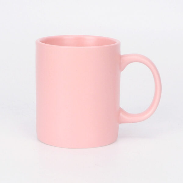 pink-matte-ceramic-coffee-cup A vibrant mustard pink matte ceramic coffee cup with a comfortable C-shaped handle for office beverage service.