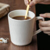 Wholesale ribbed ceramic coffee mugs with minimalist vertical texture for professional cafés