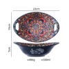 Top and side profile of a wholesale oval ceramic serving bowl with handles showing 23cm length, 15cm width, 7cm height, and 500ml capacity.