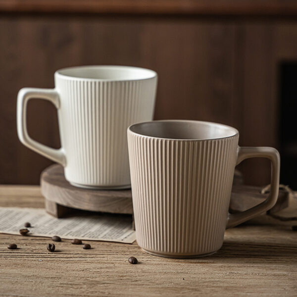 Ribbed ceramic coffee mug set in cream and taupe colors for B2B supply