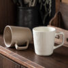 Detailed view of the ergonomic square handle on our high-quality ceramic coffee mugs