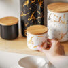 wholesale-ceramic-airtight-canister Wholesale Nordic speckled ceramic airtight canister with a natural wooden lid for kitchen food storage and coffee shop use.
