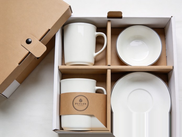 premium gift packaging for ceramic tableware with rigid boxes and branded sleeves for corporate gifting
