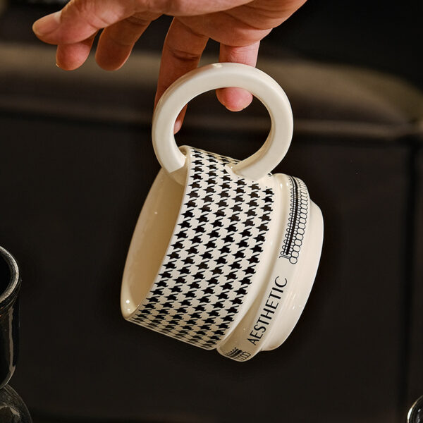 ceramic-coffee-mug-handle-detail Modern ceramic coffee mug with glossy handle detail