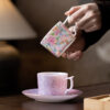 Gold rim detail on luxury ceramic cup and saucer