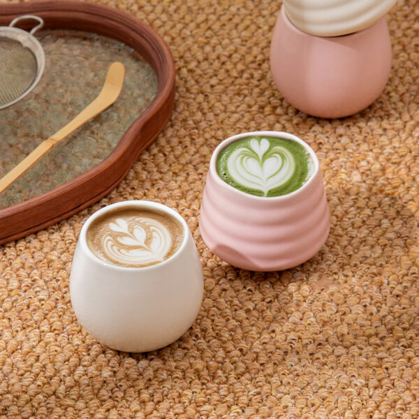 Pink and white Japanese ceramic tea cups with smooth glazed finish