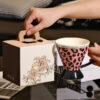 black-handle-ceramic-mug-detail Pink ceramic coffee mug with glossy black handle and base detail