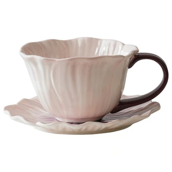 Floral ceramic coffee cup and saucer set on white background