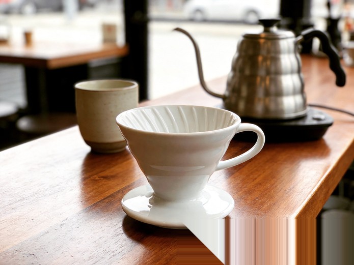 Ceramic Coffee Dripper: B2B Sourcing Guide for Cafes 1 white ceramic pour over coffee dripper displayed on a wooden cafe counter for commercial sourcing evaluation