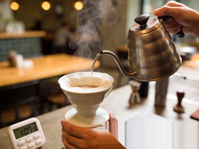 Ceramic Coffee Dripper: B2B Sourcing Guide for Cafes 3 hands pouring hot water through a ceramic coffee dripper with digital timer visible for quality gate testing