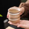 Handmade ceramic tea cup with rustic stoneware finish