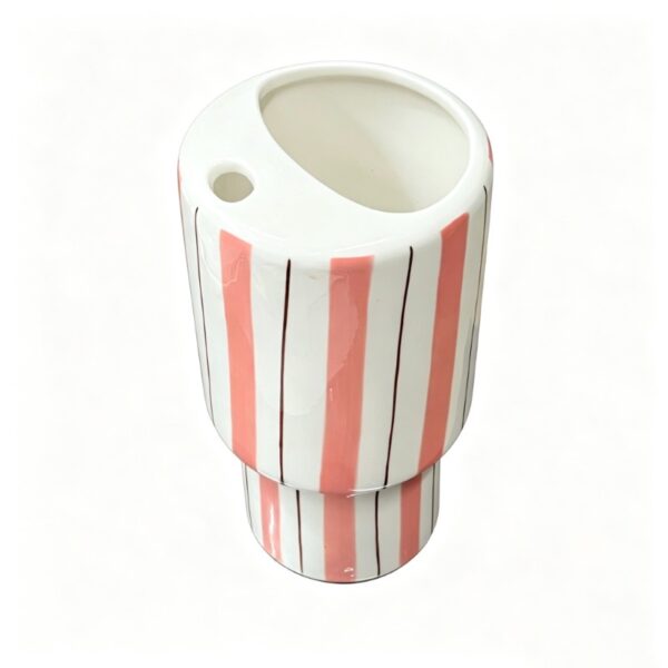 Side view of large ceramic tumbler with straw
