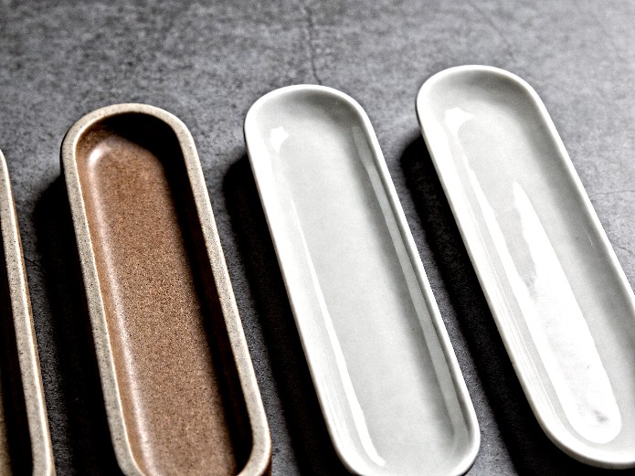stoneware and porcelain bar plates displayed side by side for material comparison in commercial bar sourcing