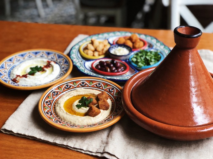 mezze plates and tagine pot displayed for Mediterranean restaurant ceramic tableware sourcing