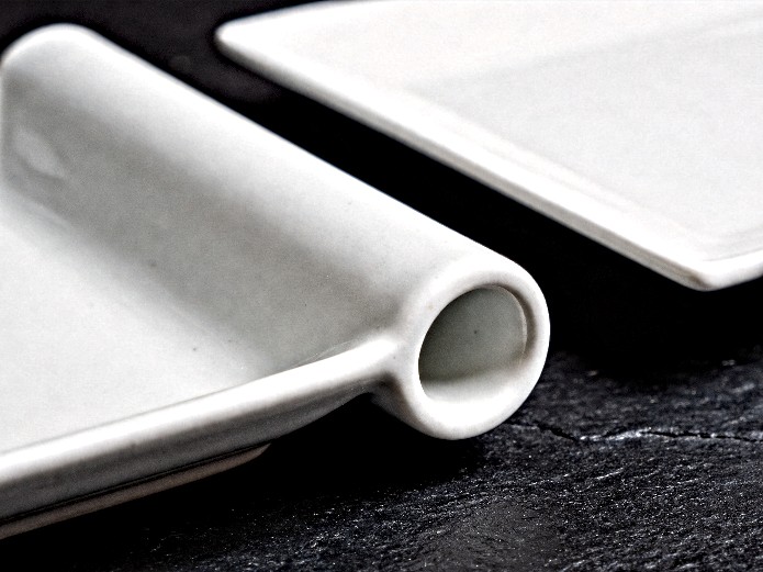 rolled edge ceramic plate compared to sharp edge plate showing durability difference for event rentals